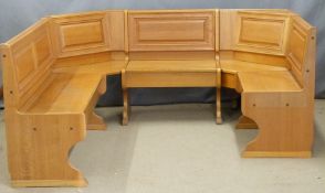 An oak semi-circular seating arrangement / dining bench with underseat storage, dimensions when
