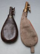 Two shot flasks, one canvas and leather with brass top the other leather with metal top, largest