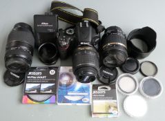 Nikon D5100 DLSR camera with Nikkor DX 18-55mm 1:3.5-5.6 and Tamron Di 18-270mm f 3.5-6.3 and Di