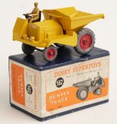 Dinky Toys diecast model Dumper Truck with yellow body and red hubs, 562, in original box.