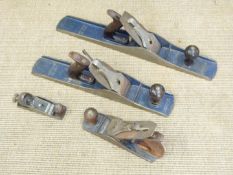 Four woodworking planes comprising Record nos 4, 6 and 7 and a small plane marked no 66