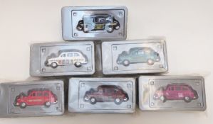 Six The Beatles album cover diecast model taxis, all sealed in original packaging.