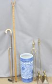 A blue and white stick stand and sticks including ivory handled, chestnut thumb stick, companion set