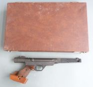 Original Model 10 .177 target air pistol with adjustable wooden grips, trigger and sights, serial