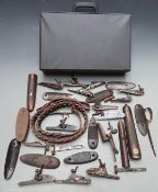 A collection of gun parts including ornately engraved locks, hammers, forends, trigger guards