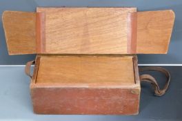 Target shooter's wooden range box with fitted interior and leather shoulder strap, 50 x 25 x 20cm.