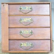 Mahogany four drawer Wellington style collectors cabinet with brass drop handles, 31x31x26cm.