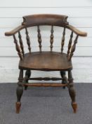An elm seated elbow chair, H77cm