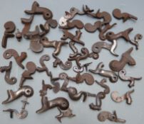 Forty various percussion and flintlock hammers, some with engraved decoration.