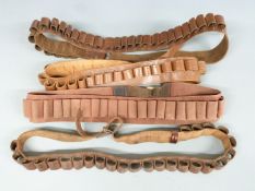 Four various 12 bore shotgun cartridge belts.