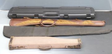 Four shotgun/ rifle cases comprising one canvas and leather leg of mutton, two slips, one Winchester