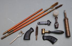 A small collection of gun tools and accessories including a spring loaded brass oiler stamped 'Brit.