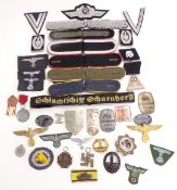 Replica Nazi German badges and insignia to include shoulder boards, Luftwaffe cap badge, U boat,