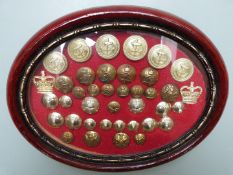 Twenty five regimental lapel/pin badges in glazed display together with a glazed display of military