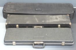 Three shotgun or rifle carry cases, largest 96x28x11cm.
