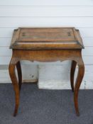 A 19thC inlaid walnut cellarette / wine table with liner, raised on cabriole legs, W65 x D41 x