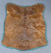 A moose skin mounted on a fabric backing with velvet surround by the National Fur and Tanning Co,