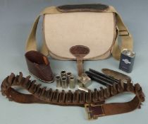 A collection of shooting and gun accessories comprising a Musto canvas and leather cartridge bag,