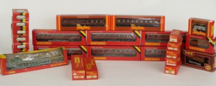 Twenty-six Hornby and Tri-ang 00 gauge model railway coaches, wagons and vans, all in original