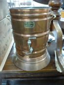 A copper 'Gem Still' water purifier, Jardiniere brass jug, large brass jam pan, large copper