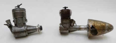 Two vintage compression ignition model aircraft engines, one AMCO the other FROG