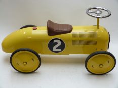 Vilac pressed steel push along 'pedal' car with yellow body, rubber tyres and racing number 2,