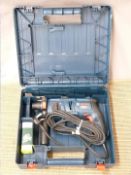 A cased Bosch GBH2000 professional electric drill, together with blades and a Draper Expert socket