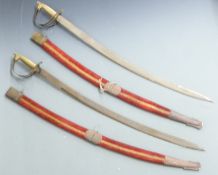 Two Indian curved daggers with inlaid handles and crude decoration, with India to 21cm blades,