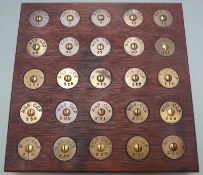 Display of twenty-five brass rifle butt stock discs for Maidstone Grammar School Junior Training