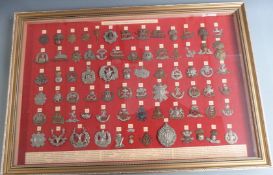 Seventy-four British Army WW1 Guards and Infantry cap badges displayed by order of precedence