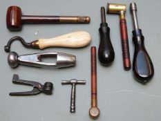 Nine various gun tools including nipple keys, powder and shot measures, bullet moulds, wad punch