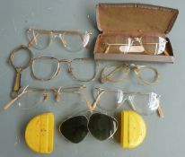 Five pairs of retro and vintage spectacles, three being of frameless design, two pairs of Art Deco