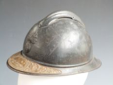 French WW1 Adrian helmet with liner and commemorative plaque to peak