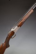 Browning B2 12 bore over and under shotgun with engraved scenes of birds to the locks and underside,