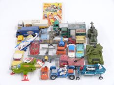 Twenty-four Dinky Toys and Dinky Supertoys diecast model vehicles including Ever Ready Batteries Guy