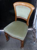 Set of six Victorian dining chairs with reeded front legs raised on castors