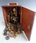 W.Watson & Sons Ltd microscope with travelling and rotating platform and further lenses below,