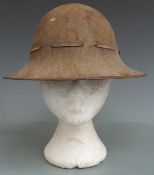 Two Civil Defence steel helmets one stamped to rim AMC 5 1941the other RO & Co 6/41 together with