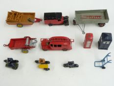 Ten Dinky Toys diecast model vehicles and accessories including Fire Engine, Royal Mail Van, AA