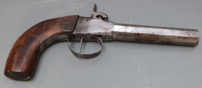 Large approximately 13 bore percussion hammer action coat pistol with carved shaped wooden grip,