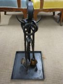 A wrought iron companion set with integral tray, H62cm