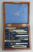 A 19thC / early 20thC Stanley mahogany cased set of drawing instruments, some with bone handles
