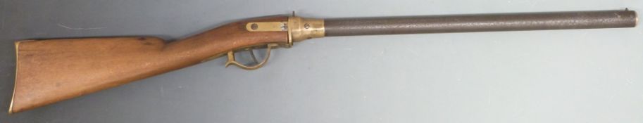 Carnival or fairground pop or cork gun with brass frame, trigger guard and butt plate, wooden ram-