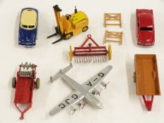 Seven Dinky Toys diecast model vehicles including Ford Sedan, aeroplane, Climax Conveyancer forklift