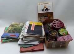 A collection of loose Meccano parts together with various outfit instructions.