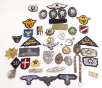 Replica mainly Nazi German badges and fabric insignia, to include enamel examples, Russian enamel
