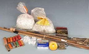 A collection of gun accessories including empty cartridges one named C Purcell 10 Worcester St