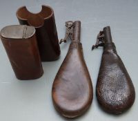 Two leather shot flasks, one with embossed markings, largest 22.5cm long, together with a leather