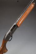 Remington model 1100 12 bore semi-automatic shotgun with ornately carved semi-pistol grip and