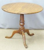 A 19thC oak tilt top table raised on a turned support and triform base, diameter 80 x H70cm